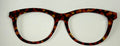 Brook Topper; metal; burgundy  and gold circles on black