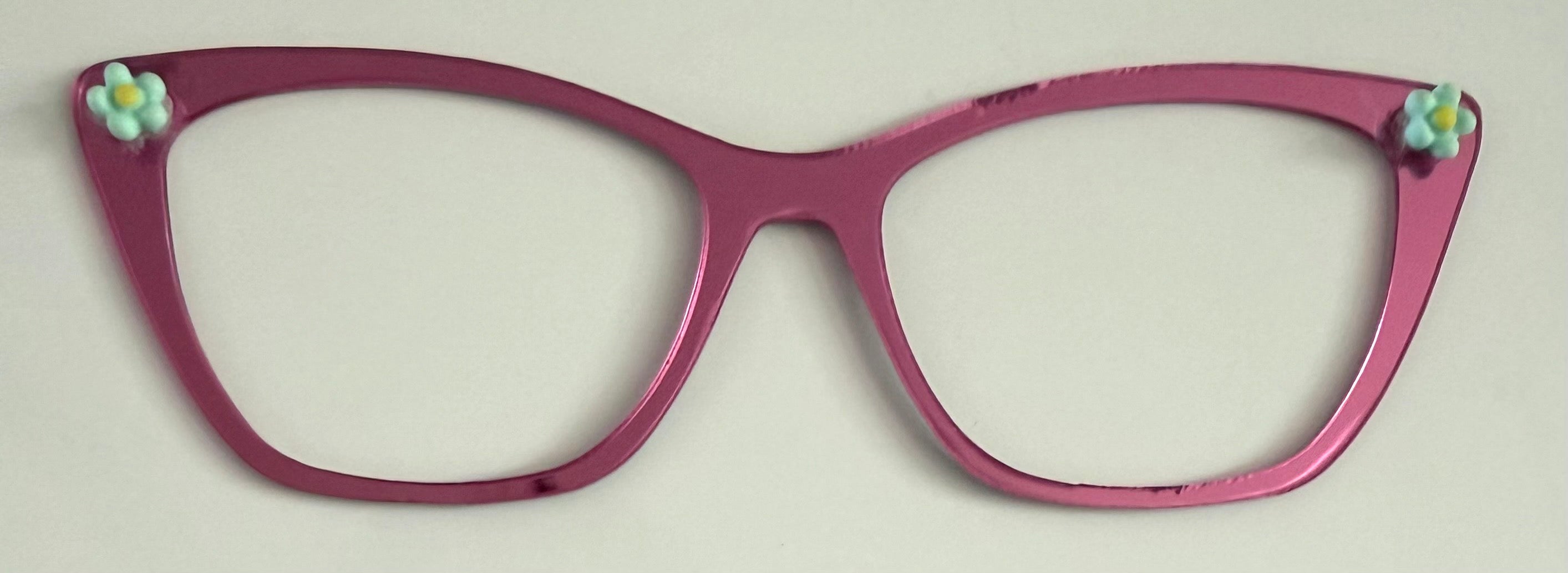 Wanda Topper; pink mirror with flower embellishments