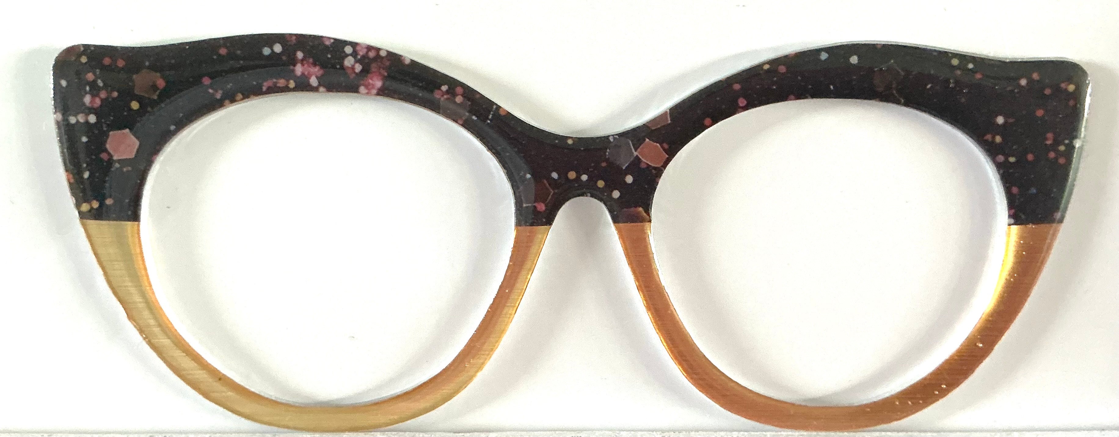 Zuri Topper; Creator; pink spotted design on black/gold split