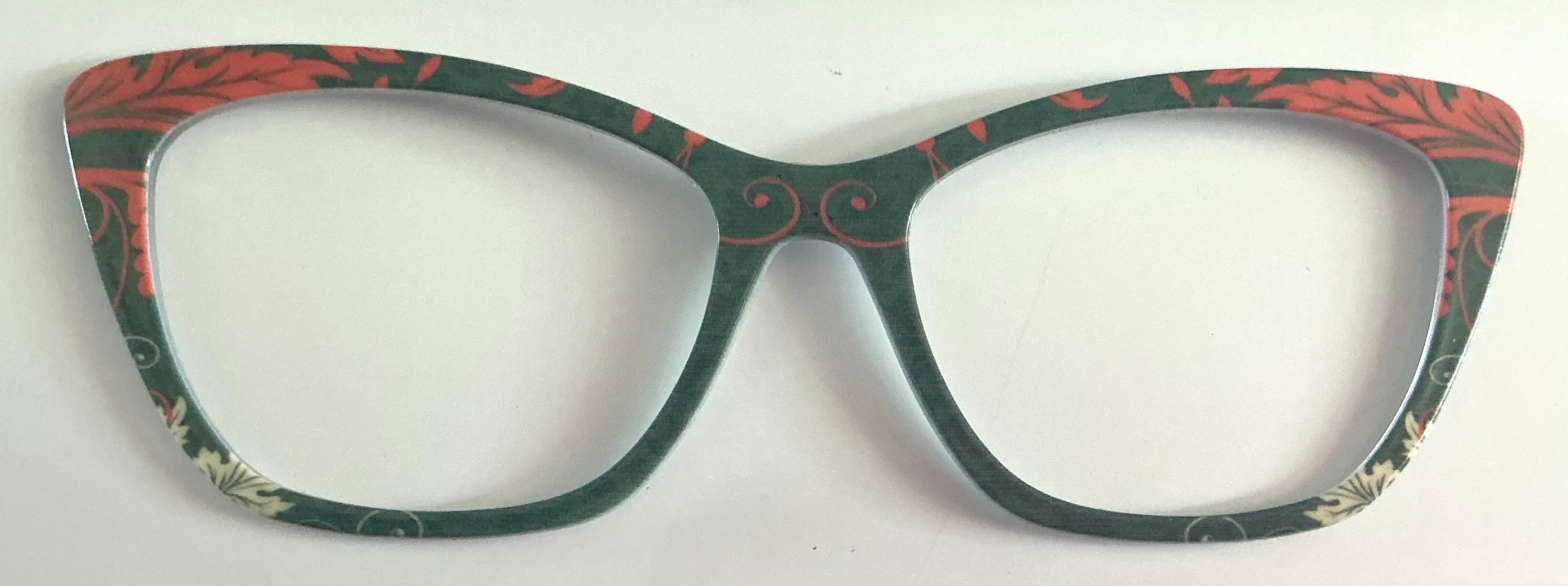Wanda Topper; coral ornate leaves on green