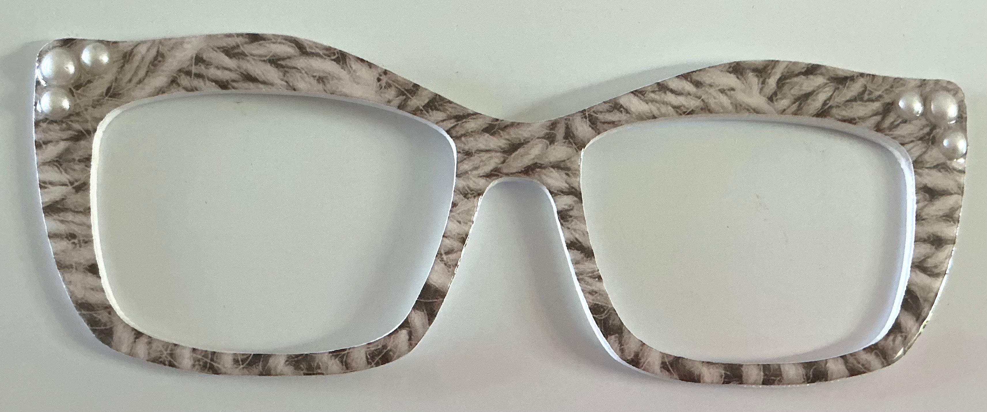 Kirby Topper; Creator; gray and white design with pearls in corners