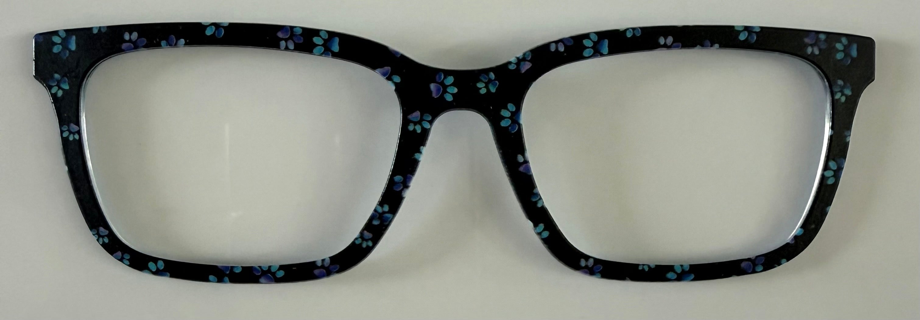 Larkin Topper; green and purple paw prints